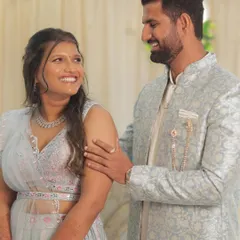 A candid moment between the couple. The bride's makeup is designed to look flawless from every angle, with a focus on a radiant base and soft, defined features for her ring ceremony.