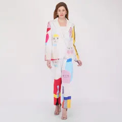 A full-length shot of a model in a creative, multi-colored pantsuit. We ensure the fit and pattern are displayed clearly for customers evaluating the entire outfit.