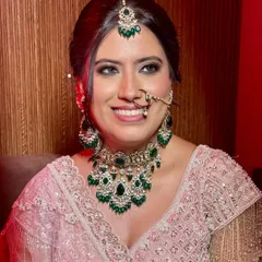 Grace in every gaze, sparkle in every detail. A bride wrapped in blush dreams and timeless charm, her smile says it all.