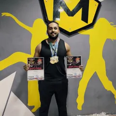 Celebrating success right here at the gym. Our champion athlete, Srinivas, proudly displays his World Cup diplomas and medals, inspiring the entire MultiFit community.