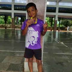 A young champion shows off his 100m bronze medal. We focus on age-appropriate training that helps kids develop speed and technique while having fun.