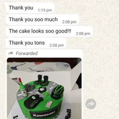 "The cake looks soo good!!!" A happy client's message after receiving their custom Kawasaki biker-themed cake.