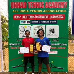 NTC's Sajal Kesharwani and his partner celebrate their Men's Doubles win at the AITA 1 Lakh Tennis Tournament in Lucknow.