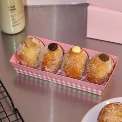 Our assorted bomboloni box is pure happiness. These fluffy Italian doughnuts are rolled in sugar and filled with delicious creams like Nutella, vanilla custard, and more.