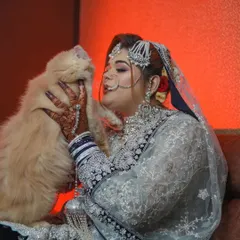 Even furry family members are part of the celebration. This incredibly sweet and personal moment shows the bride sharing a loving nuzzle with her cat on her wedding day.
