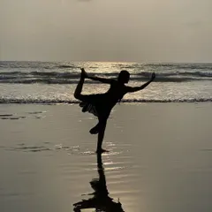 A reflection of Dancer's Pose against the setting sun. This pose builds strength in the standing leg and core while opening the heart.