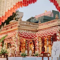 This is tradition with the volume turned all the way up. We designed this opulent temple-style mandap to feel like a sacred monument, using intricate golden pillars and dramatic floral arrangements for a truly royal muhurtham.