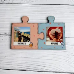 These couple's puzzle fridge magnets fit together to symbolize a perfect match. Each piece holds a different photo and a short message like "You Complete" and "My World."