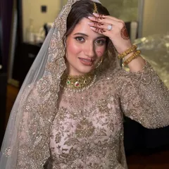 This bride's golden-hued Nikkah outfit called for a makeup look that was equally radiant. I focused on creating a warm, glowing complexion with soft, defined eyes, making her look and feel like royalty.
