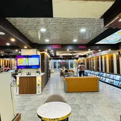 This image captures the modern and elegant ambiance of the showroom. From designer doors to wall panels, you can discover everything you need to transform your space.