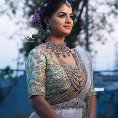 The complete look from the side, showing how the hairstyle, makeup, and outfit come together. A well-executed hairstyle is crucial for balancing the entire bridal look.
