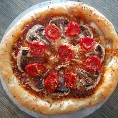 Who says you can't have a stuffed crust pizza that's both vegan and gluten-free? This one features a crust filled with my homemade vegan cheese, topped with mushrooms and cherry tomatoes.
