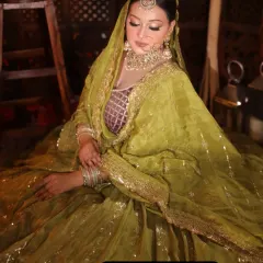 This olive green lehenga with a sequined dupatta is a popular and elegant choice for a mehendi function. The color is unique and photographs beautifully.