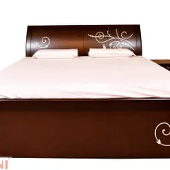 This wooden bed features a simple, modern design elevated by delicate white inlay work on the headboard and footboard. It's a subtle artistic touch that adds a unique character to the piece.
