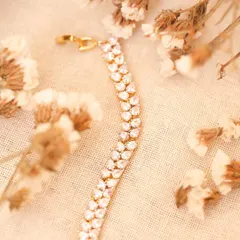 A creative product shot of the same bracelet styled with dried flowers. This type of lifestyle shot is perfect for social media and brand storytelling.