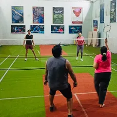 A classic mixed doubles match in full swing at our Sion court. This is our home turf, where the community comes together to play, improve, and have a great time.