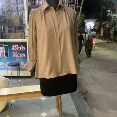 A classic beige casual shirt with pleated bishop sleeves and wide cuffs. This is a perfect staple piece for a college or work wardrobe, made to your exact measurements.