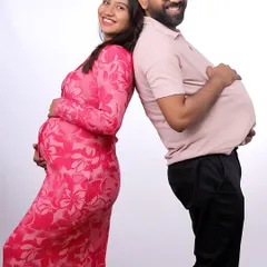 A fun and lighthearted moment from a studio maternity shoot. We love capturing the joyful and playful side of your journey together.