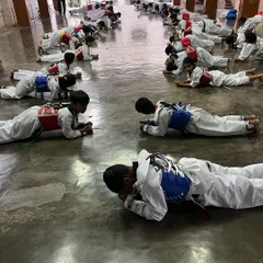 "We only start counting when it starts hurting." My students hold a plank, a core conditioning exercise that builds immense physical and mental strength, inspired by the words of Muhammad Ali.