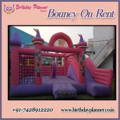 Perfect for a princess or fairy-tale theme party, this pink and purple bouncy castle is available for rent. It features a spacious jumping area, safety netting, and an attached inflatable slide for extra fun.