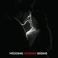 A powerful black and white close-up, using rim lighting to highlight the couple's profiles. This high-contrast, intimate shot marks the beginning of their wedding journey.