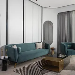Another view of the living area, highlighting the curved wall details and the interplay of light and shadow. The layout is designed for both relaxation and social gatherings, making it a versatile and stylish heart of the home.