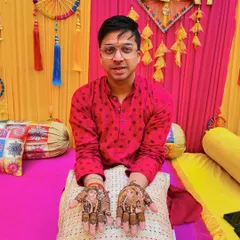 Another shot of the groom's portrait mehendi, showcasing the detailed artwork against a festive backdrop.