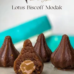 Our Lotus Biscoff Modak, cut open to reveal a molten Biscoff spread center. It's a modern, caramelized twist on the festive classic.