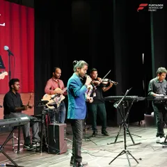 A student band takes the stage at the annual recital at CSN School, Pune. This performance showcases the collaborative spirit I foster, with students on vocals, violin, keyboard, and guitar playing in harmony.