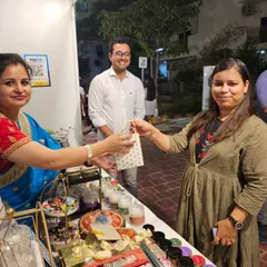 Sharing a moment with a customer. Even after your purchase, I'm here to ensure your experience is filled with joy, just like the delightful aroma of my candles.