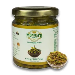 A close-up of my popular Green Chilli Pickle. I use fresh, crisp green chillies and a mix of mustard seeds and spices, all preserved in cold-pressed oil. It’s a simple, classic, and fiery addition to any Indian meal.