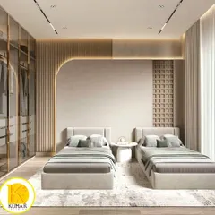 An elegant and spacious bedroom with twin beds, perfect for a guest room or for siblings. The design features a stunning glass and gold-trim wardrobe and a curved, fluted accent wall.