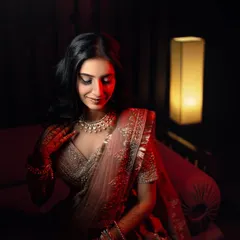 Through the lens, she’s more than a bride. A moody and elegant portrait of the bride, with the red light highlighting her features and creating a cinematic feel.