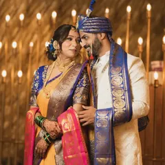 A beautifully lit portrait of a Maharashtrian couple. The warm lighting and their shared glance make this a timeless photograph from their wedding day.