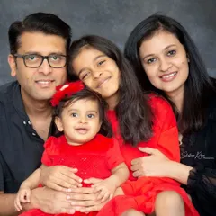 This beautiful family of four is coordinated in red and black for their studio portrait. Capturing the connection between family members is what makes my heart sing.