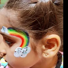 This rainbow and clouds design is a cheerful and popular choice for kids' parties. The glitter on the clouds adds a magical sparkle.