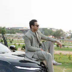 Proof that grooms can have their hero moment too. The groom looks effortlessly stylish in his custom-fitted sage green sherwani, a modern and unconventional choice for his wedding day.