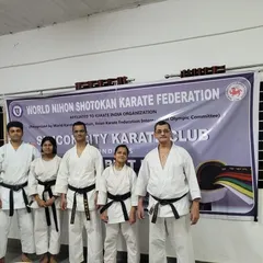 Our senior black belt instructors and students stand before the World Nihon Shotokan Karate Federation banner during a recent belt exam at the Silicon City dojo.