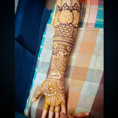 Another shot focusing on the name 'Fardin' integrated into the bridal mehandi.