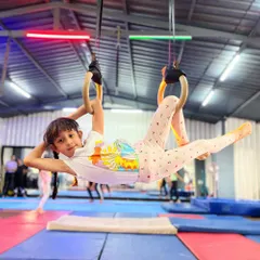 It all starts with a smile. We make fitness fun for our youngest athletes, helping them build confidence and coordination on the gymnastic rings while discovering a love for movement.