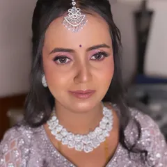 A duplicate of image 95, showing a close-up of the reception makeup with delicate pink eyeshadow.