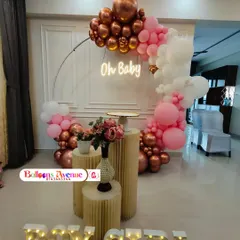 Celebrating a new arrival with our popular "Oh Baby" gender reveal setup. This design features a beautiful balloon arch in rose gold, pink, and white, an elegant neon sign, and light-up "BOY GIRL" letters to build excitement for the big announcement.