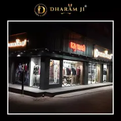 Another view of our studio's exterior at night, showcasing the latest collections in the window display.