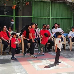 Parents and children enjoying our annual sports day. We foster a strong sense of community at our school.
