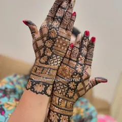 A beautiful example of a full-coverage design with a mix of floral and geometric patterns, perfect for a bride's sister or close friend.