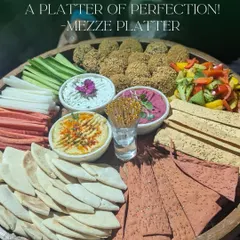 This is my take on a perfect Mezze Platter. It includes creamy hummus and beetroot dip, fresh falafel, crisp vegetable sticks, and a variety of pita and lavash, offering a healthy and flavorful option for your guests.
