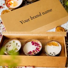 If you dream of starting your own candle brand, we can help. This is an example of our white-labeling service, where we create beautiful coconut shell candles and package them in custom boxes with your brand name.