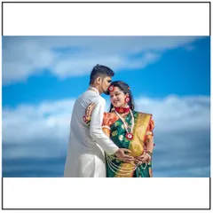 A tender moment between the expecting couple, highlighting their connection. The groom-to-be's touch and her serene smile make this a beautiful memory.
