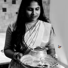 A black and white photo capturing a moment from a traditional ceremony. This timeless style focuses on the emotion and the ritual itself.