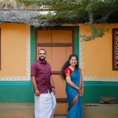 A charming shot in front of a colorful, rustic village house. This setting is perfect for couples who want a traditional and down-to-earth pre-wedding theme.